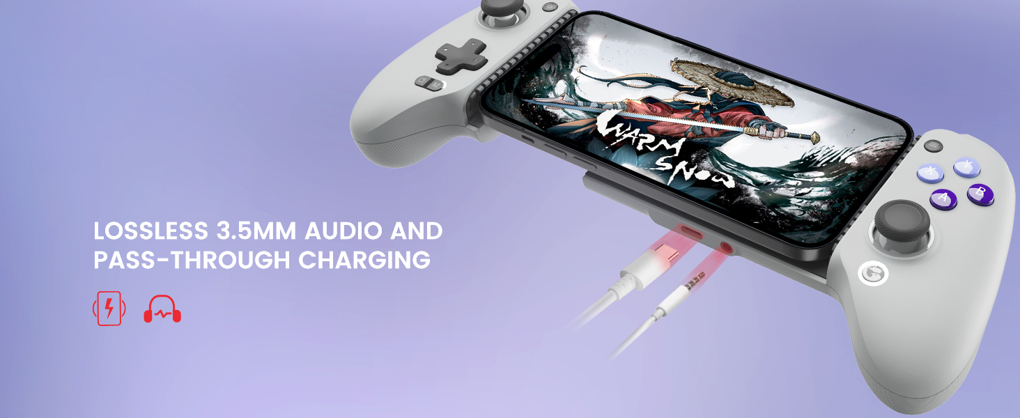 Handheld gaming device with white body and gray grips. Screen displays action game. Text mentions '3.5mm audio' and 'pass-through charging'.